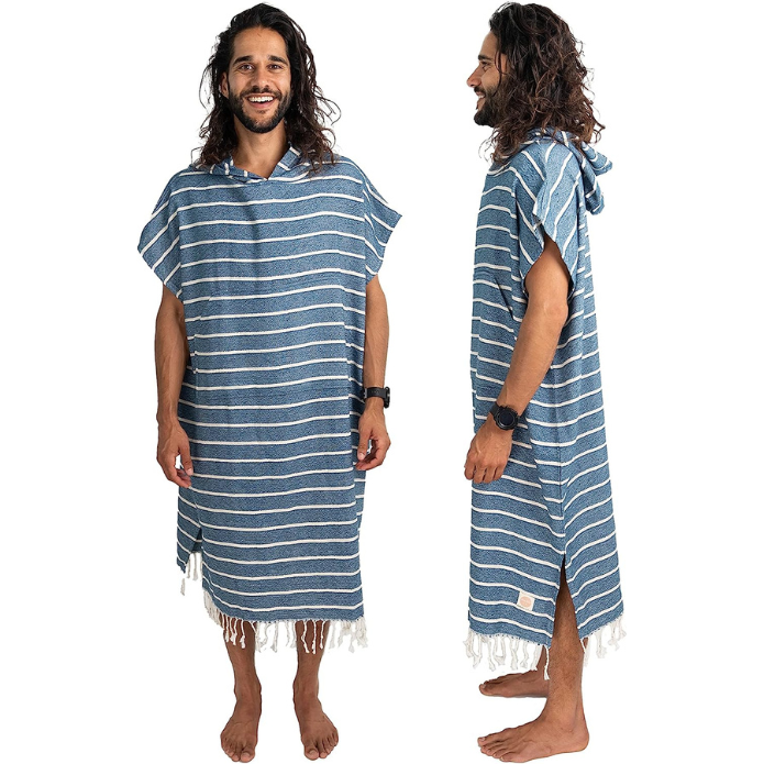A man wearing a comfortable surf poncho.